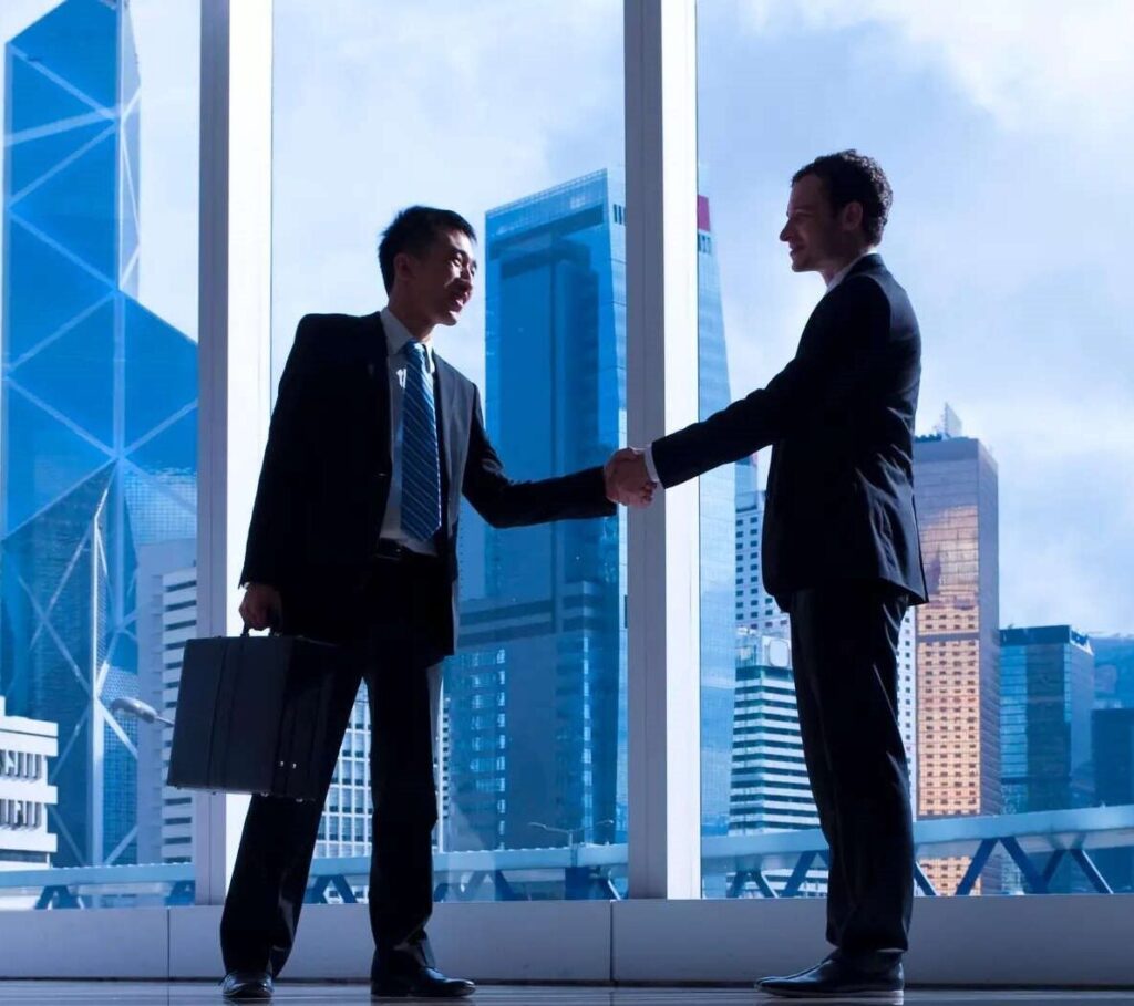 two businessman doing handshake .